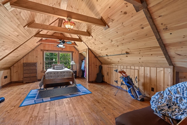 bedroom with wood walls, wood ceiling, and light wood-type flooring