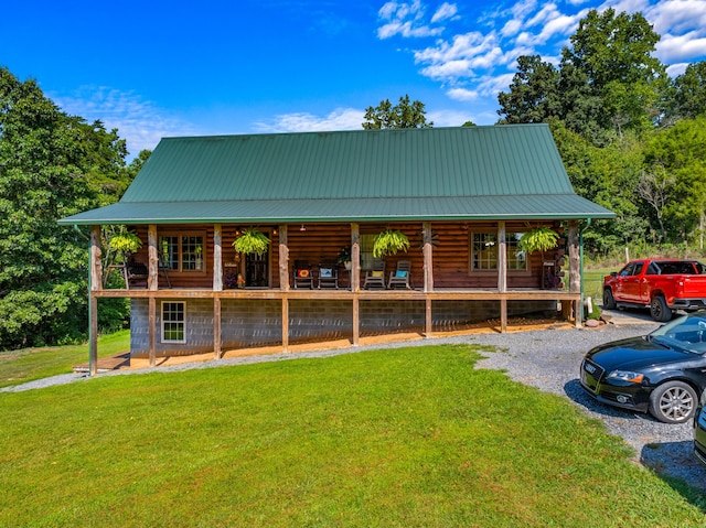 view of front of property with covered porch and a front yard