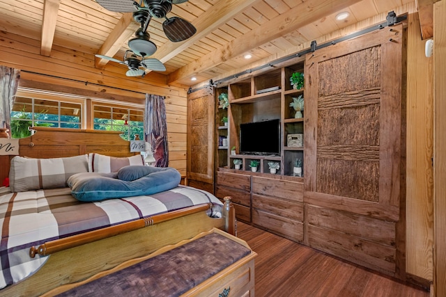 bedroom featuring wood ceiling, beam ceiling, a barn door, dark hardwood / wood-style floors, and wood walls