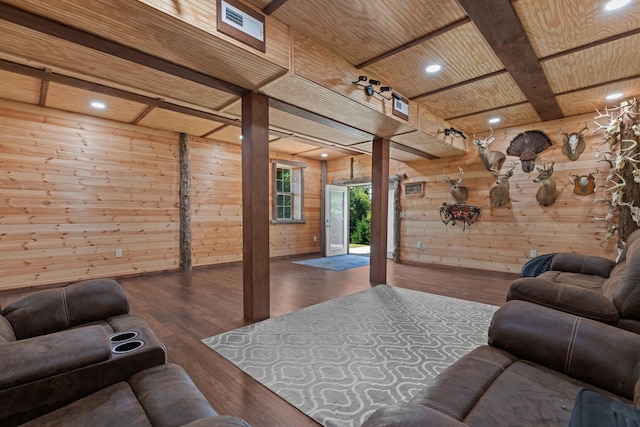 living room with beamed ceiling, wooden walls, dark wood-type flooring, and wooden ceiling