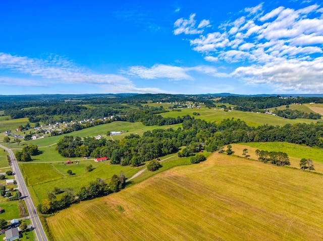 birds eye view of property with a rural view