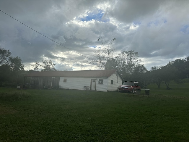 rear view of house with a lawn