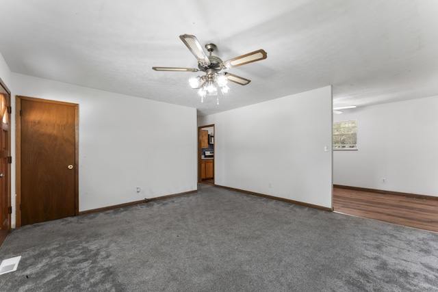 carpeted empty room with ceiling fan