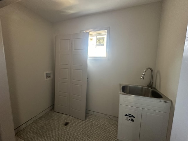 washroom with light tile patterned floors and sink