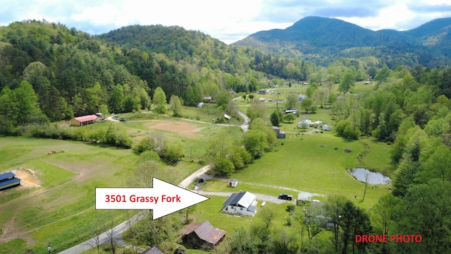 3501 Grassy Fork Rd, Hartford, TN 37753 - aerial view of sparsely populated area featuring a mountain backdrop and a heavily wooded area