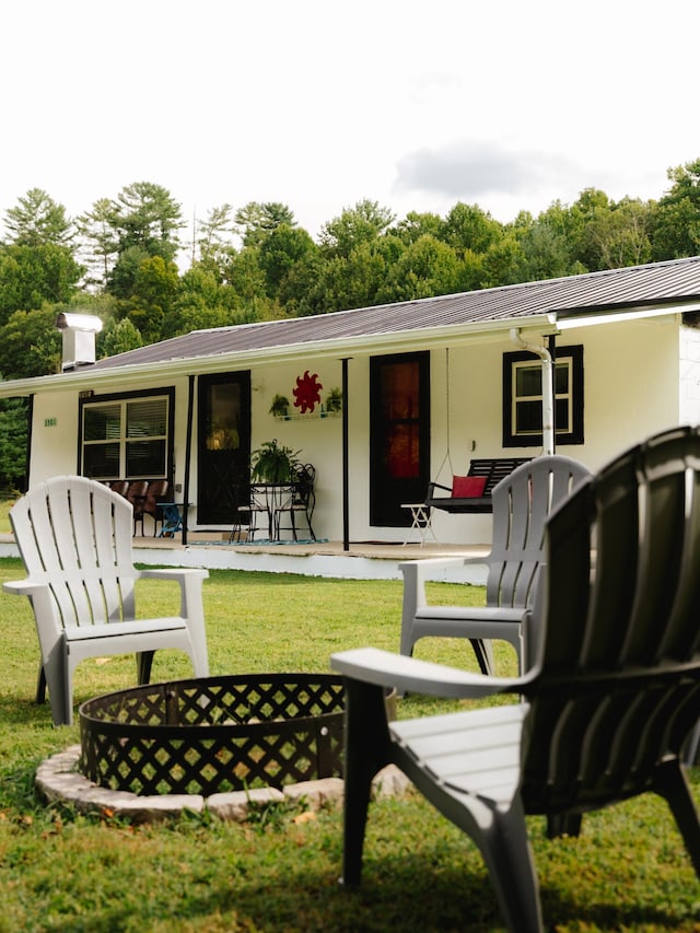 3501 Grassy Fork Rd, Hartford, TN 37753 - rear view of property with a porch, stucco siding, and metal roof