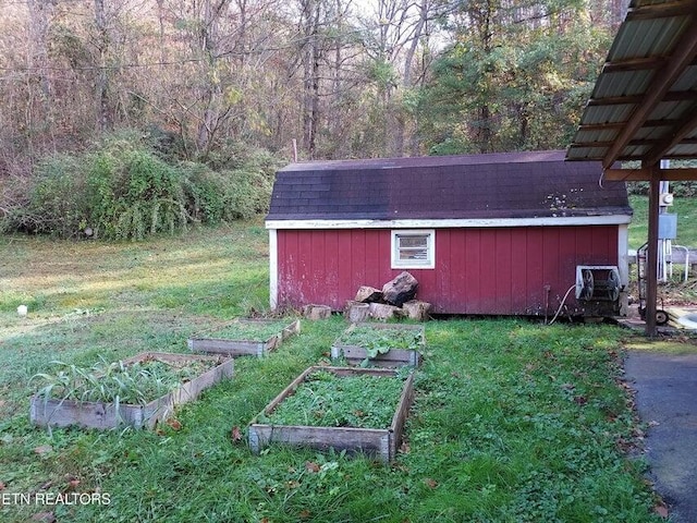 view of outdoor structure with a lawn