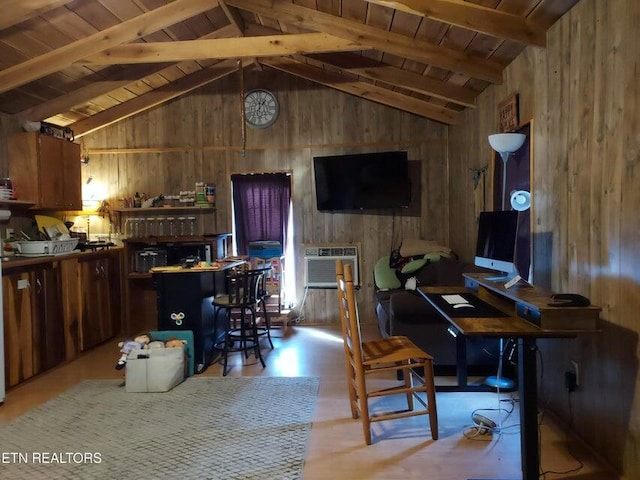 office area with vaulted ceiling with beams, a wall unit AC, wooden ceiling, and wooden walls