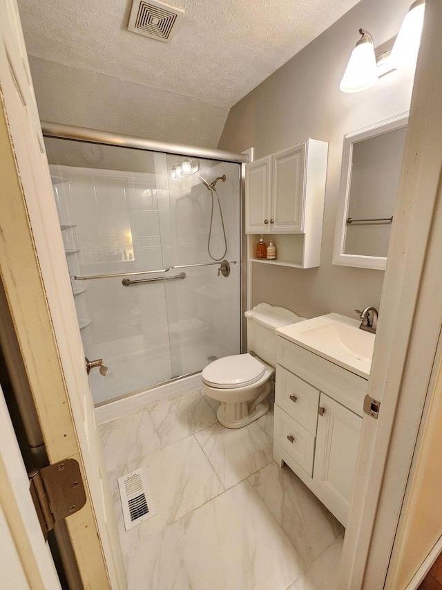 full bathroom featuring a textured ceiling, visible vents, toilet, marble finish floor, and a stall shower