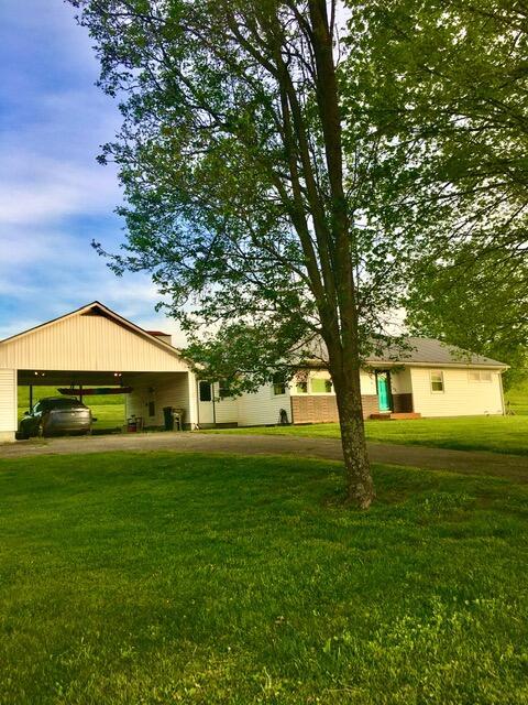 view of yard with a carport