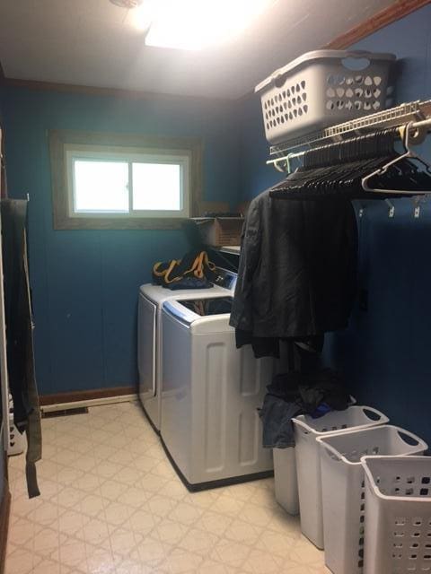 laundry area with washing machine and dryer