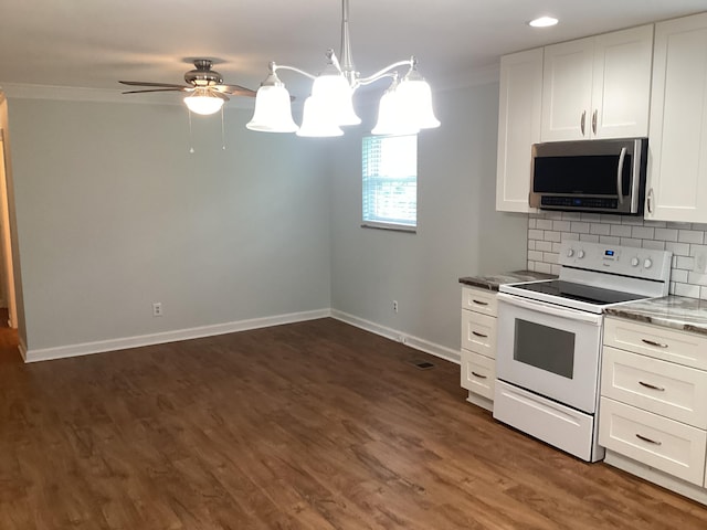 kitchen with white electric range oven, white cabinets, hanging light fixtures, and ornamental molding