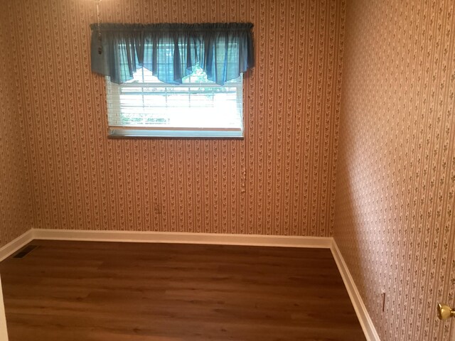 empty room featuring hardwood / wood-style flooring