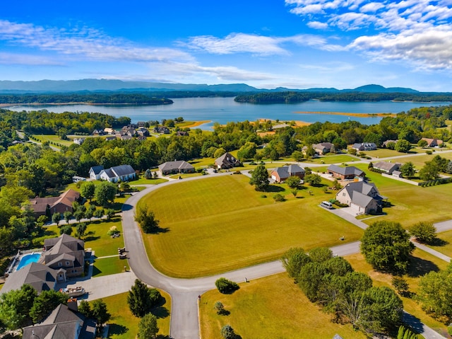 aerial view featuring a water and mountain view