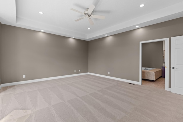 interior space featuring light colored carpet and ceiling fan