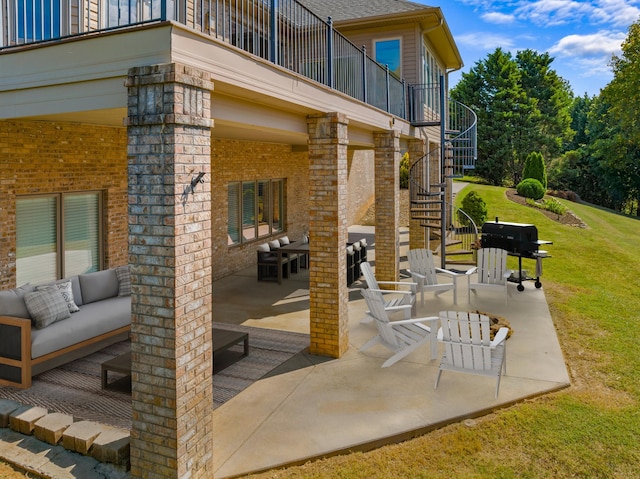 view of patio with a balcony and an outdoor living space