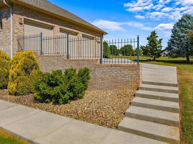 view of side of home featuring a garage