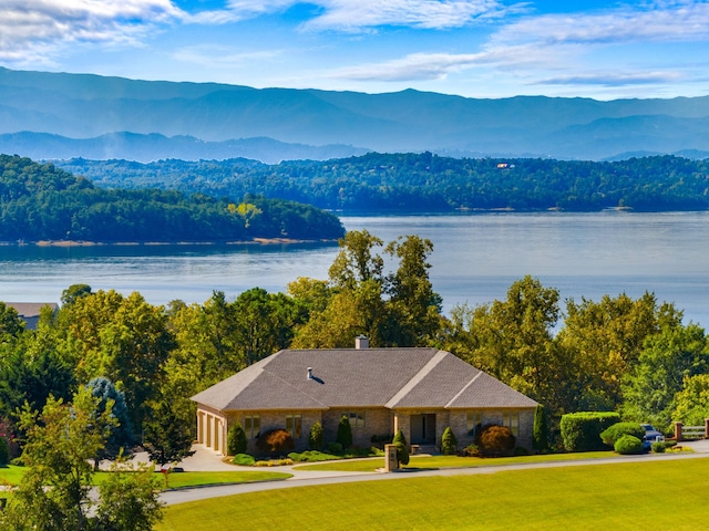 aerial view featuring a water and mountain view