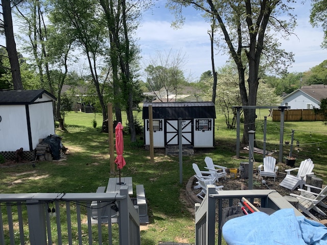 1306 Tabitha Dr, White Pine, TN 37890 - view of grassy yard featuring an outdoor fire pit and view of wooded area