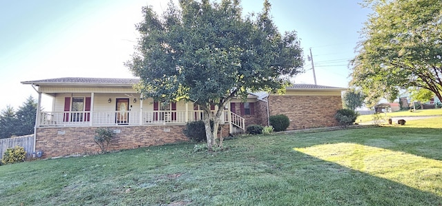 ranch-style home with a front lawn and a porch