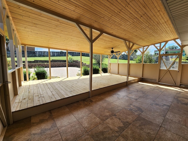 exterior space featuring ceiling fan, a water view, and wood ceiling