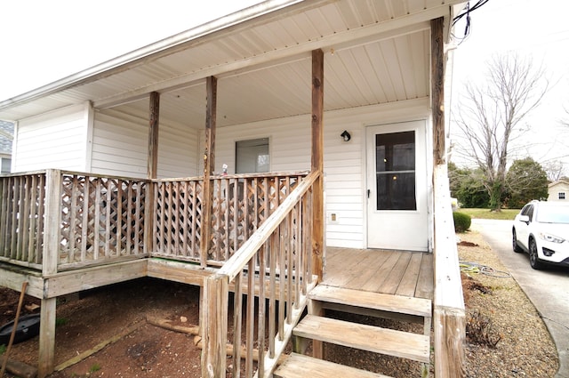 view of exterior entry featuring a porch