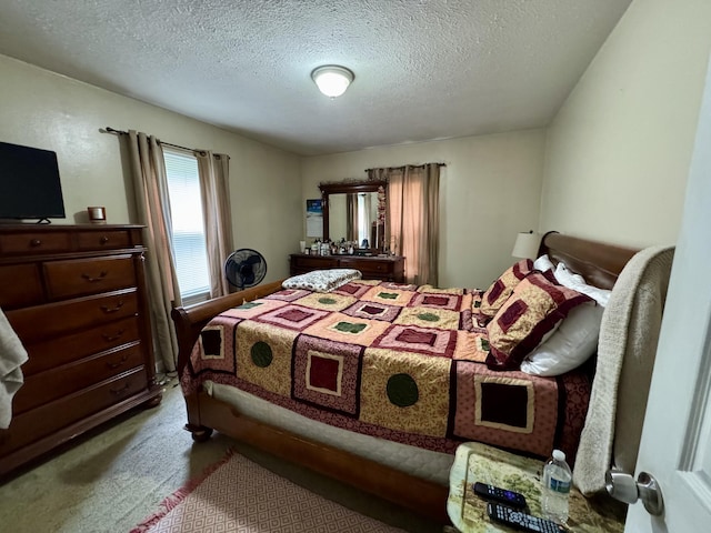 carpeted bedroom with a textured ceiling