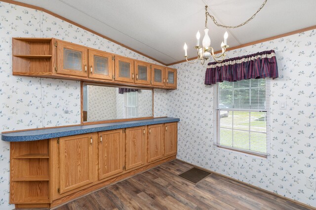 kitchen with a chandelier, open shelves, lofted ceiling, visible vents, and wallpapered walls