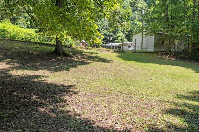 view of yard with a forest view