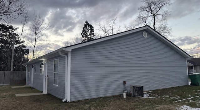 view of side of home featuring central air condition unit