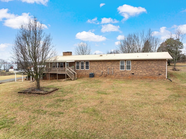 back of house with a wooden deck, a yard, and cooling unit