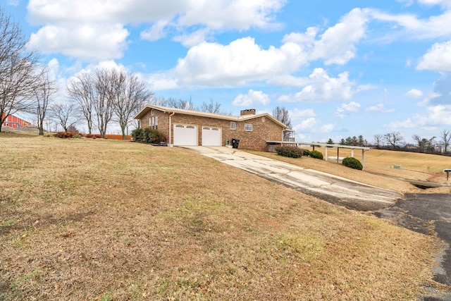 single story home featuring a garage and a front yard