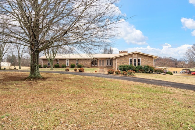 ranch-style house with a front yard