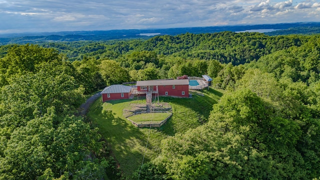 view of subject property featuring a forest