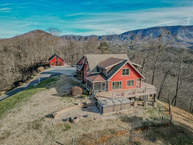 back of house with a mountain view