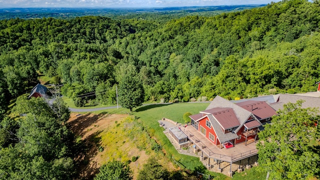 view from above of property with a forest