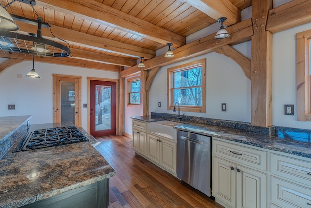 kitchen with sink, hanging light fixtures, dark stone counters, wooden ceiling, and stainless steel appliances