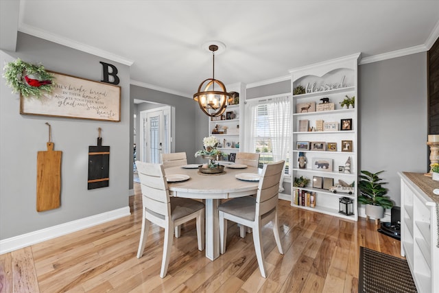 2940 Beecarter Rd, Dandridge, TN 37725 - dining area featuring a notable chandelier, baseboards, ornamental molding, and light wood-style flooring
