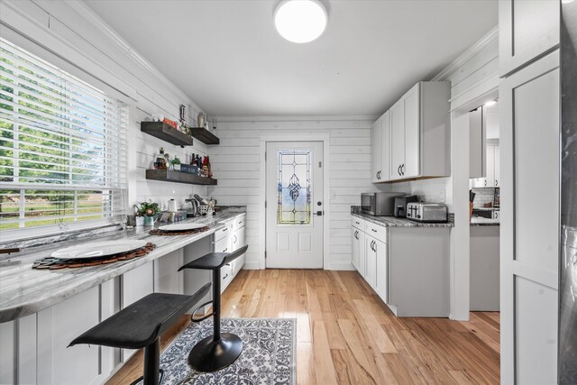 2940 Beecarter Rd, Dandridge, TN 37725 - kitchen featuring a toaster, white cabinetry, crown molding, open shelves, and light wood-style floors