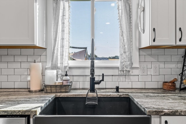 2940 Beecarter Rd, Dandridge, TN 37725 - kitchen with white cabinets, a sink, and decorative backsplash
