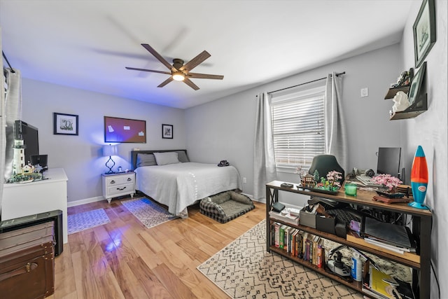 2940 Beecarter Rd, Dandridge, TN 37725 - bedroom featuring light wood-type flooring, ceiling fan, and baseboards