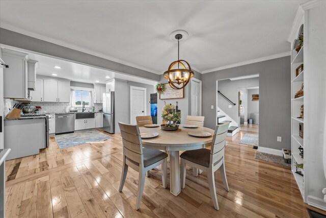 2940 Beecarter Rd, Dandridge, TN 37725 - dining space featuring light wood-style flooring, ornamental molding, recessed lighting, a chandelier, and stairway