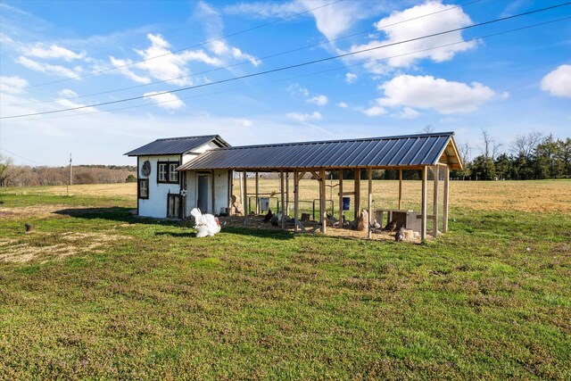 2940 Beecarter Rd, Dandridge, TN 37725 - back of property featuring metal roof, an outdoor structure, and a lawn