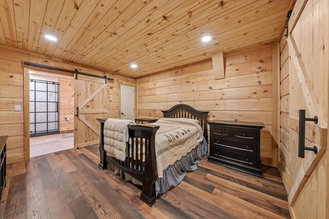 2940 Beecarter Rd, Dandridge, TN 37725 - bedroom with recessed lighting, wooden walls, a barn door, dark wood finished floors, and wooden ceiling
