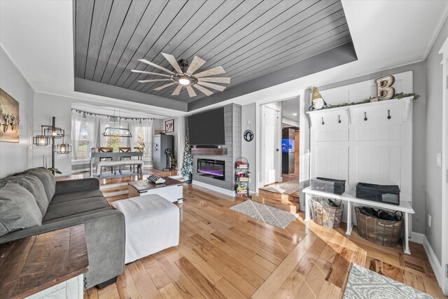 2940 Beecarter Rd, Dandridge, TN 37725 - living room with baseboards, a raised ceiling, a ceiling fan, wood ceiling, and light wood finished floors