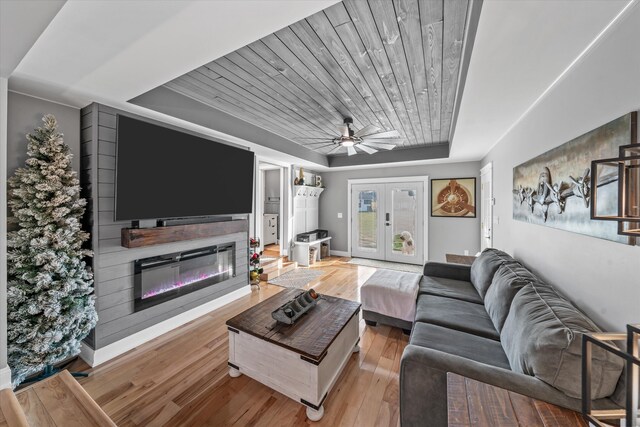 2940 Beecarter Rd, Dandridge, TN 37725 - living room featuring baseboards, a raised ceiling, ceiling fan, light wood finished floors, and french doors