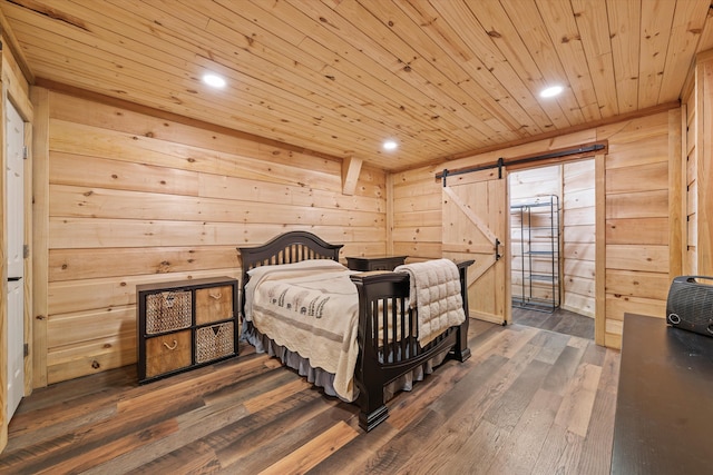 2940 Beecarter Rd, Dandridge, TN 37725 - bedroom featuring recessed lighting, a barn door, hardwood / wood-style floors, wooden ceiling, and wooden walls
