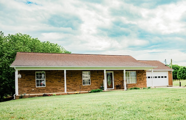 ranch-style house with a front lawn, a garage, and brick siding