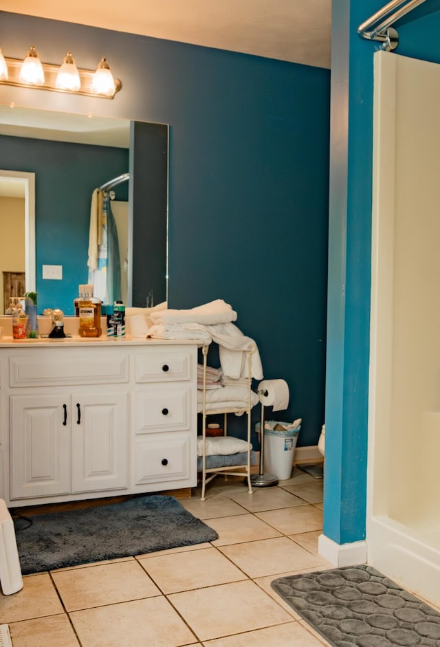 bathroom featuring a shower, tile patterned flooring, and vanity