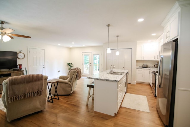 1161 Wooddale Rd, Morristown, TN 37814 - kitchen featuring appliances with stainless steel finishes, a sink, open floor plan, white cabinets, and recessed lighting